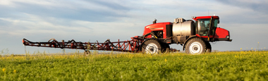 Photo of sparyer in field with crops